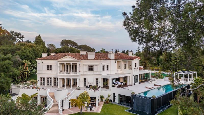 The Weeknd's new home features a waterfall on the side of the outdoor pool.